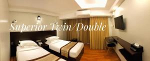Katil atau katil-katil dalam bilik di Hotel Rose Hill