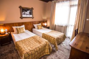 Postel nebo postele na pokoji v ubytování Elida Family Hotel