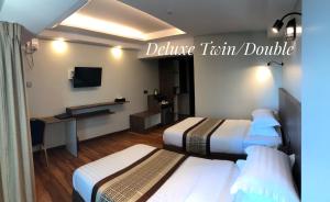 Katil atau katil-katil dalam bilik di Hotel Rose Hill