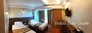 Katil atau katil-katil dalam bilik di Hotel Rose Hill