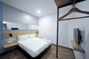 Postel nebo postele na pokoji v ubytování MYe Hotel