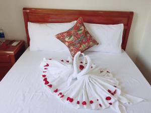 Postel nebo postele na pokoji v ubytování CANH DUONG MOTEL