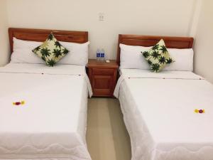 Postel nebo postele na pokoji v ubytování CANH DUONG MOTEL