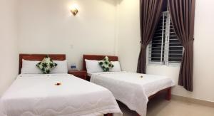 Postel nebo postele na pokoji v ubytování CANH DUONG MOTEL