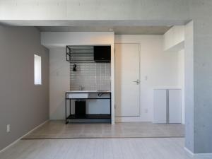 an empty kitchen with a sink and a stove at AOCA KAMINOGE 401 in Tokyo