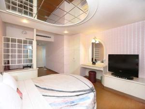 TV a/nebo společenská místnost v ubytování Midi Motel Tainan Branch