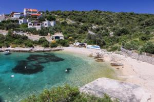 an aerial view of a beach with boats in the water at Apartments Darinka in Sevid