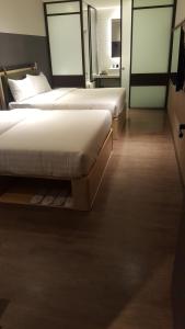 Ένα ή περισσότερα κρεβάτια σε δωμάτιο στο City Suites - Main Station