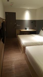 Ένα ή περισσότερα κρεβάτια σε δωμάτιο στο City Suites - Main Station