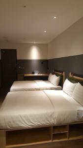 Ένα ή περισσότερα κρεβάτια σε δωμάτιο στο City Suites - Main Station