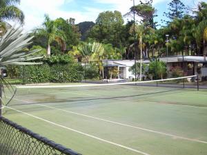 a tennis court with a net on it at Banana Coast Caravan Park in Coffs Harbour