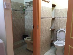 a bathroom with a toilet and a shower at Exotic Copa Cabana Beachftont in Flic-en-Flac +23 photos