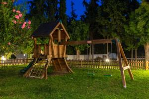 a wooden play set in a yard at Matoula Beach in Ialysos
