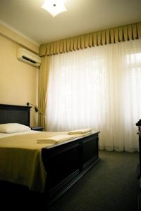 
Кровать или кровати в номере Отель Пальма
