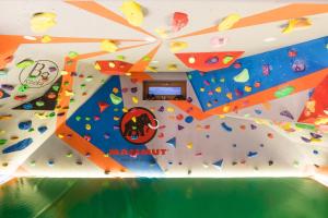 a large room with a climbing wall and a climbing gym at Cubrynka in Zakopane