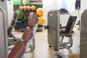 a row of chairs in a gym at Mountainlodge Luxalpine in San Vigilio Di Marebbe