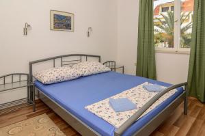 Giường trong phòng chung tại Holiday Home Lovište