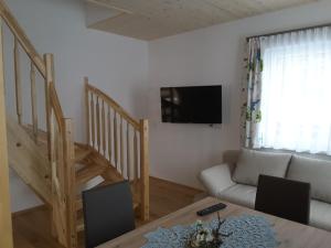 Televízia a/alebo spoločenská miestnosť v ubytovaní Ferienwohnung Paula