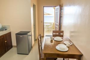 Kuchyň nebo kuchyňský kout v ubytování Kellocks' Seaview Apartelle