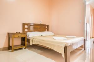 Postel nebo postele na pokoji v ubytování Kellocks' Seaview Apartelle