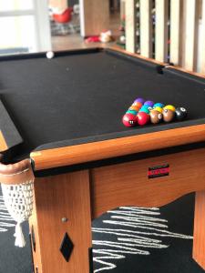 a pool table with balls on top of it at ibis Recife Aeroporto in Recife