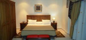 Ένα ή περισσότερα κρεβάτια σε δωμάτιο στο Brahmi Hotel