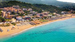 an aerial view of a beach in a resort at Ocean View Rooms in Paralia Vrachou