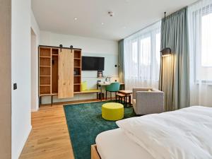 Postel nebo postele na pokoji v ubytování Hotel Federwerk