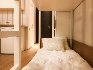 a bedroom with a white bed in a room at VISTA Gudauri - White decision in Gudauri