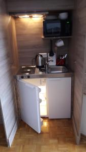 Kuchyň nebo kuchyňský kout v ubytování Gästehaus Zwischenberger