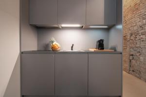 A kitchen or kitchenette at OFFICINE CAVOUR Piazza Cavour