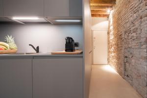 A kitchen or kitchenette at OFFICINE CAVOUR Piazza Cavour