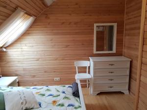 Postel nebo postele na pokoji v ubytování Guest House Ziedkalni