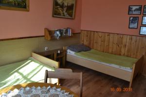 Tempat tidur dalam kamar di Bylinka
