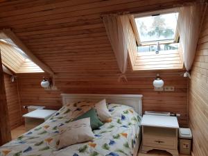 Postel nebo postele na pokoji v ubytování Guest House Ziedkalni