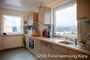 Kuchyň nebo kuchyňský kout v ubytování Ferienwohnung Kany