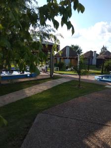 a park with a swimming pool and a building at Termas Sol Y Luna in Termas del Daymán
