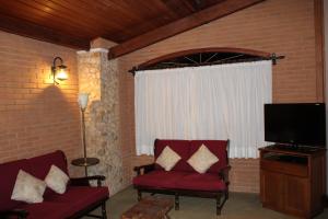 Et tv og/eller underholdning på Casa Aconchegante no Capivari