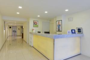 a lobby of a hospital with a counter at iCheck inn Sukhumvit 19 in Bangkok