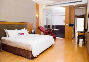 Postel nebo postele na pokoji v ubytování Royal Group Motel Chien Kuo Branch