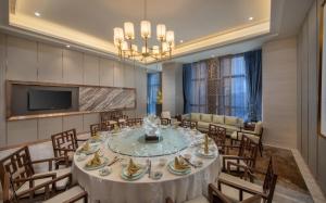 TV a/nebo společenská místnost v ubytování Shenyang Huaqiang Novlion Hotel