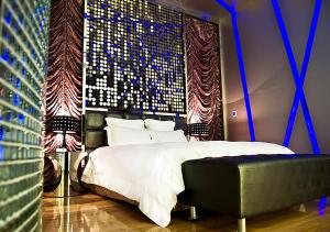 Postel nebo postele na pokoji v ubytování Royal Group Motel Ming Zu Branch