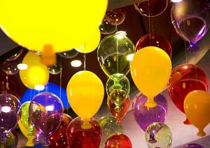 a bunch of colorful balloons hanging from a ceiling at Royal Group Motel Feng Shan Branch in Kaohsiung