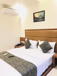 Postel nebo postele na pokoji v ubytování Hotel West Blue