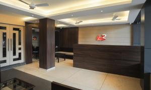 a lobby with a k store with a sign on the wall at Treebo Trend Balaji Residency in Kolhapur