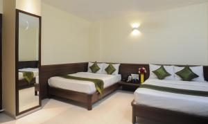 Treebo Balaji Residency客房内的一张或多张床位