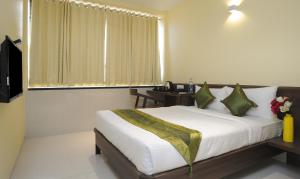 Treebo Balaji Residency客房内的一张或多张床位