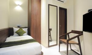 Treebo Balaji Residency客房内的一张或多张床位