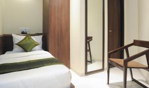 Treebo Balaji Residency客房内的一张或多张床位