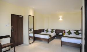 Treebo Balaji Residency客房内的一张或多张床位